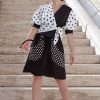 Black A-line skirt with polka dot printed pockets